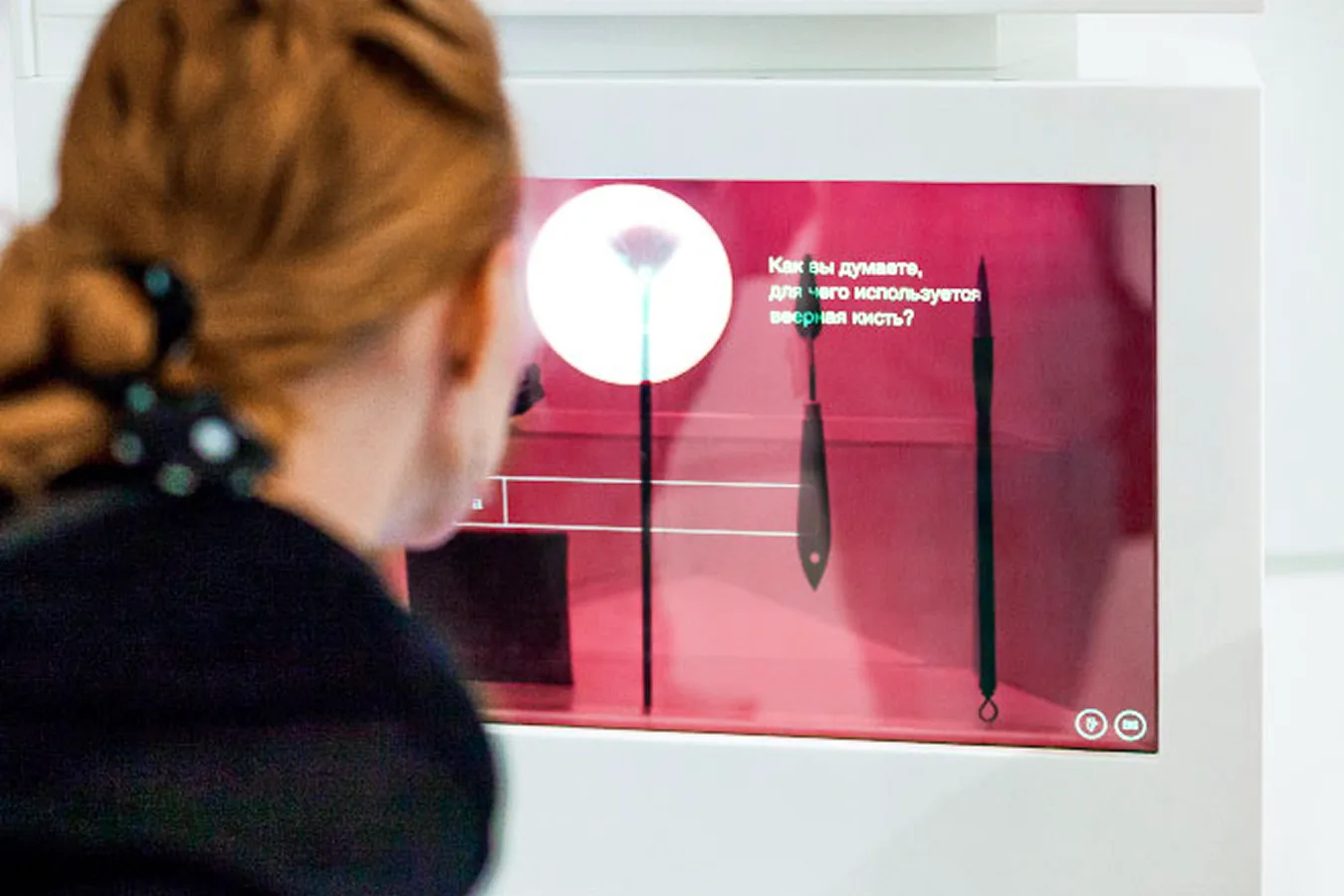Visitor viewing an explanation for a selected artist tool.